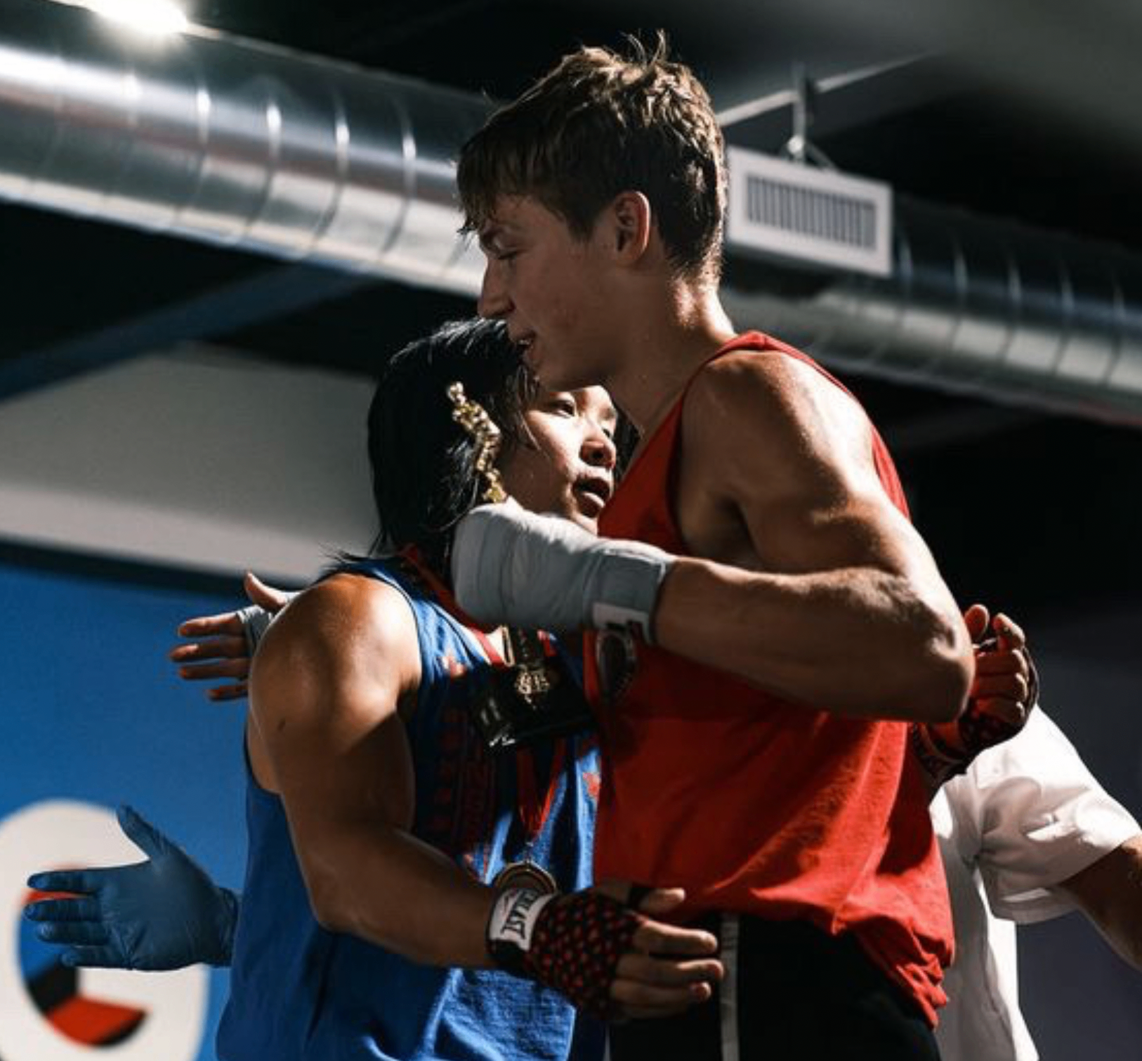 Miles embracing his opponent after a Muay Thai fight